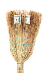 Broom sweep the dollars close-up