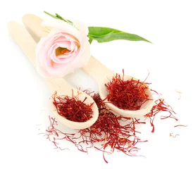 Wall murals Herbs 2 stigmas of saffron in wooden spoons isolated on white close-up