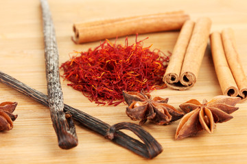Fragrant spices on wooden background close-up