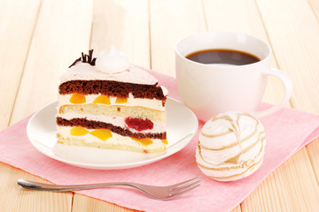 Layered fruit cake on wooden table
