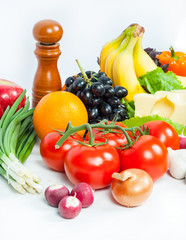 Fresh vegetables and fruits on white