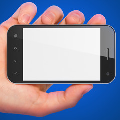 Hand holding smartphone on blue background. Generic mobile smart