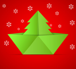 concept of the Christmas tree and origami boat.