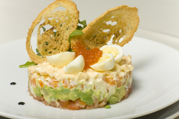 salmon under a fur coat with croutons