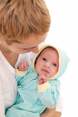Young woman holds on hands her newborn baby