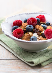Muesli with fresh fruits, almonds and raisins