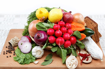 Healthy food. Fresh vegetables and fruits on a wooden board.