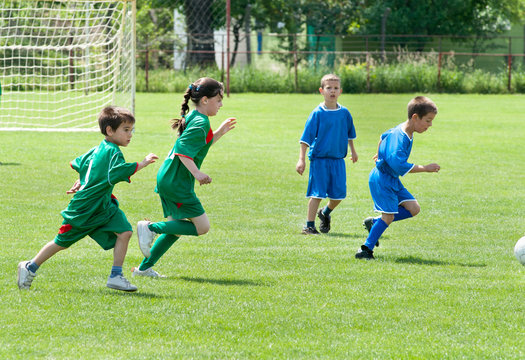 children playing soccer