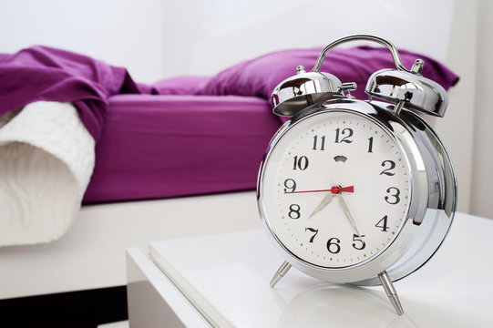 alarm clock on bedside table
