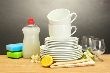 empty clean plates, glasses and cups with dishwashing liquid,