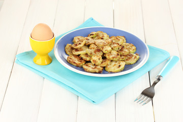 roasted squash in a blue bowl with the egg for breakfast
