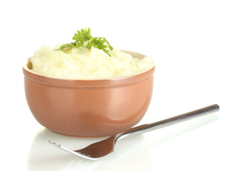 Mashed potato with parsley in the bowl isolated on white