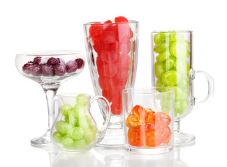 Color candies in glasses isolated on white