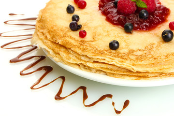 Delicious pancakes with berries and jam