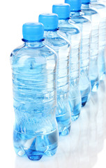 Naklejka premium plastic bottles of water isolated on white
