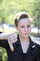 Attractive Businesswoman with Thumbs Down