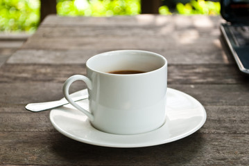 Coffee cup and laptop for business.