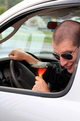 Naklejka premium Man In Truck Holding Alcohol Looking Back At Camera