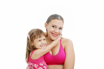 Portrait of Hispanic pregnant woman with daughter isolated over