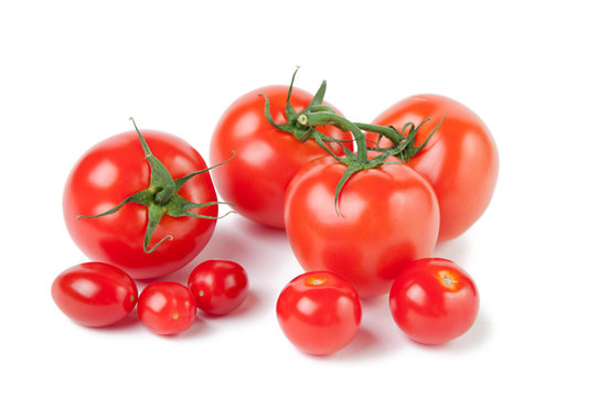 Variety of ripe tomatoes, isolated over white background