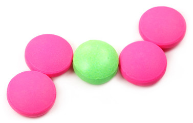 Fototapeta na wymiar Pink and green tablets