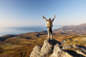 Man on the top of the mountain