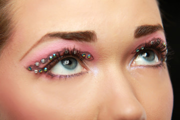 Naklejka premium Woman eye with exotic style makeup