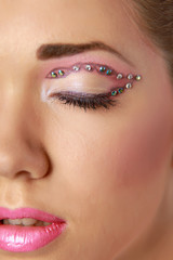 Naklejka premium Woman eye with exotic style makeup