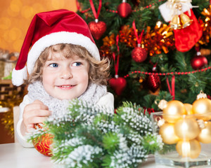 Happy child in Santa`s hat