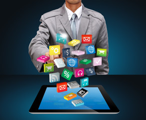 Tablet PC with cloud of colorful application icons
