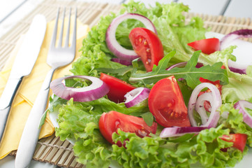 Fresh salad with tomatoes and onion