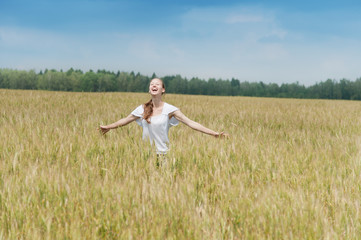 Happy woman in a meadow