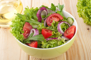 Fresh salad with cucumbers tomatoes and onions