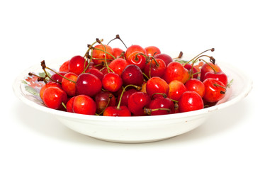 yellow and red cherries in bowl