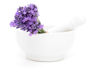 Mortar and a bouquet of lavender isolated on white background