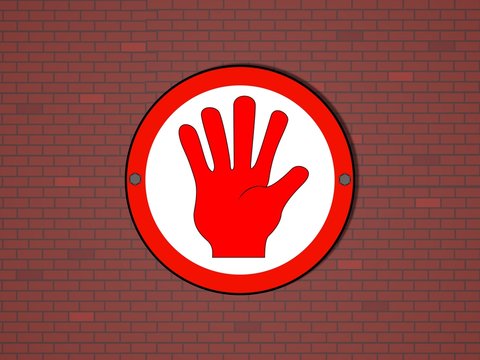Stopschild an einer Mauer