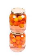 Jar of homemade plum compote, isolated on white