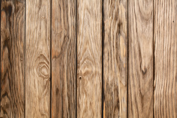 Planks of wood showing the grain patterns and knots in texture