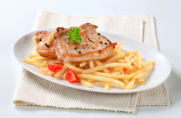 Pan fried pork chops with fries