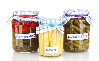 Jars with canned vegetables isolated on white