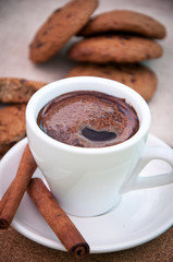 cup of coffee and cookies with chocolate