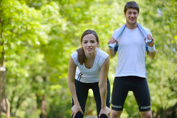 Couple doing stretching exercise  after jogging
