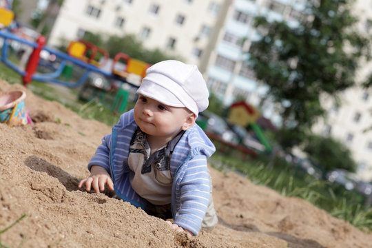 Baby Crawling In Sandbox