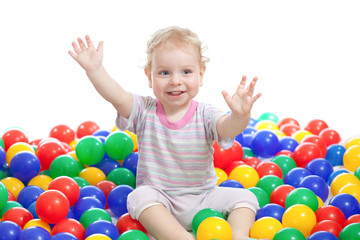 Fototapeta na wymiar Happy boy playing colorful balls isolated on white