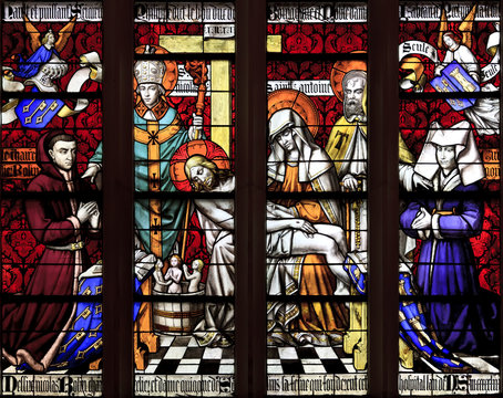 The stained glass window of Piety at hospice in Beaune