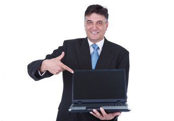 senior businessman pointing at laptop