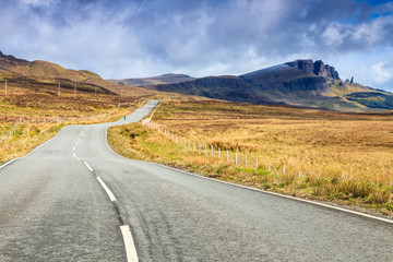Empty highway through a desolate landscape