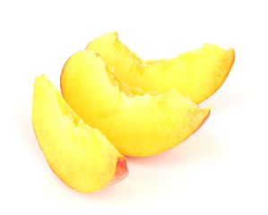 ripe peach slices isolated on white.