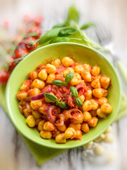 homemade gnocchi with tomato sauce, selective focus