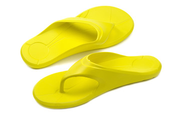Yellow flip flops, white background
